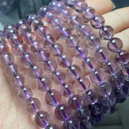 2 браслета. Примерно 8 мм натуральных прозрачных светло-фиолетовых бусин из амтиезного кварца.